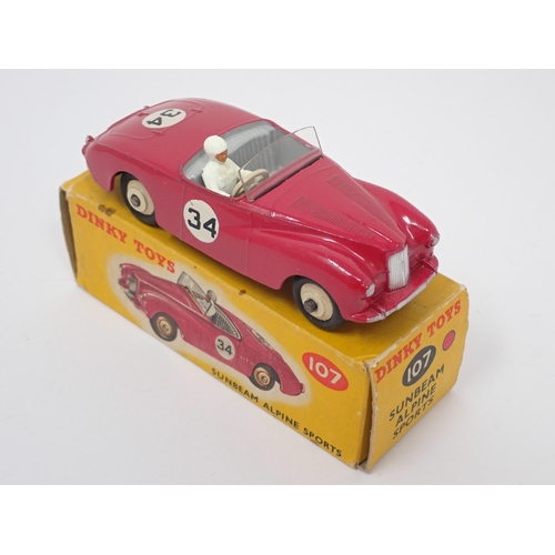 1235 - A boxed Dinky Toys No.107 maroon Sunbeam Alpine Sports