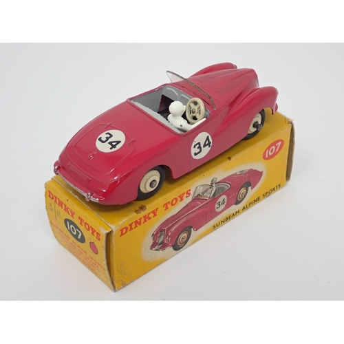 1235 - A boxed Dinky Toys No.107 maroon Sunbeam Alpine Sports