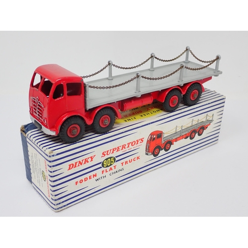 1238 - A boxed Dinky Toys No.905 red and grey Foden Flat Flat Truck with chains