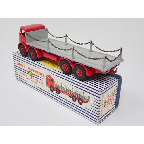 1238 - A boxed Dinky Toys No.905 red and grey Foden Flat Flat Truck with chains