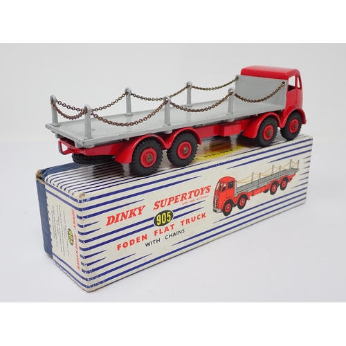 1238 - A boxed Dinky Toys No.905 red and grey Foden Flat Flat Truck with chains