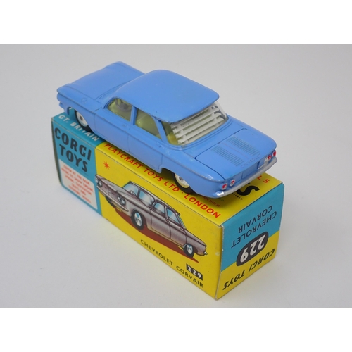 1254 - A boxed Corgi Toys No.229 blue Chevrolet Corvair