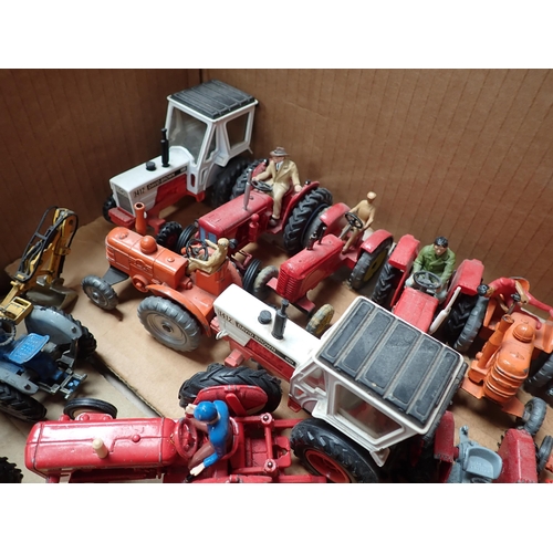 1295 - A box of unboxed Britains, Dinky, Corgi Toys and other Tractors and Combine Harvesters