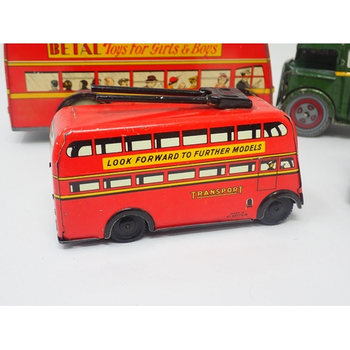 1384 - Two Brimtoy tinplate double decker Buses and two clockwork Buses