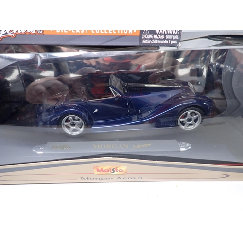 1405 - A boxed Maisto 1/18 scale Premiere Edition Morgan Aero and Aston Martin DB7 Vantage, a boxed Mazda M... 