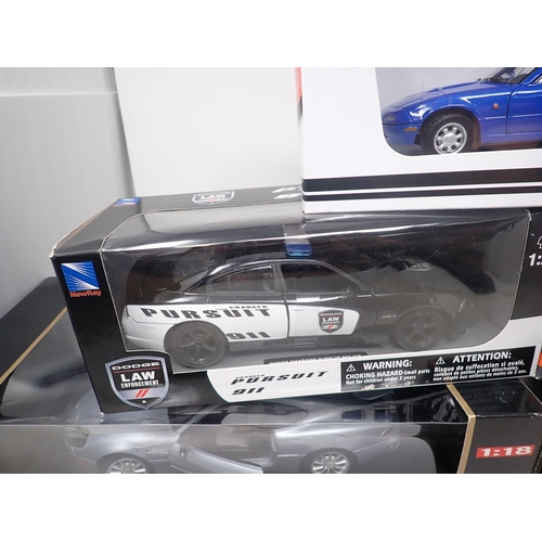 1405 - A boxed Maisto 1/18 scale Premiere Edition Morgan Aero and Aston Martin DB7 Vantage, a boxed Mazda M... 