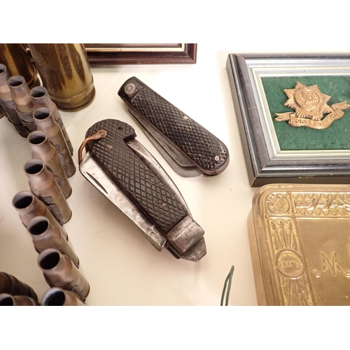 1470 - A mixed lot of Militaria including Mary Christmas 1914 Tin, two Cap Badges, two Jack Knives, inert m... 