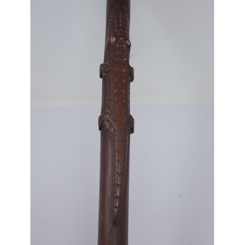 1486 - A Papua New Guinea P.N.G. Staff with carved head handle above crocodile and snake 2ft 10in L