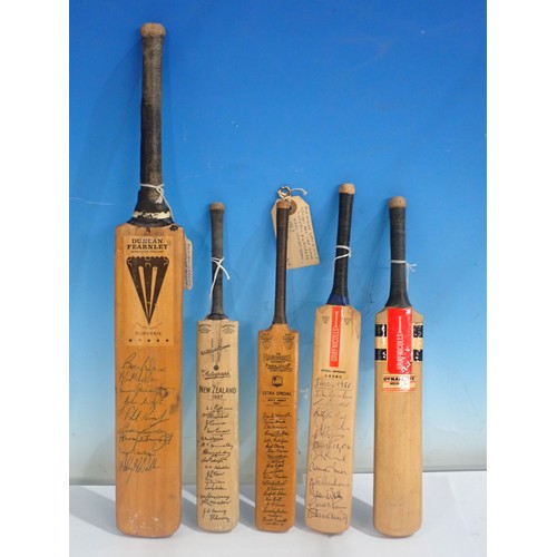 1663 - Five miniature Cricket Bats including Gray-Nicholls signed by Sussex 1986 team and printed New Zeala... 