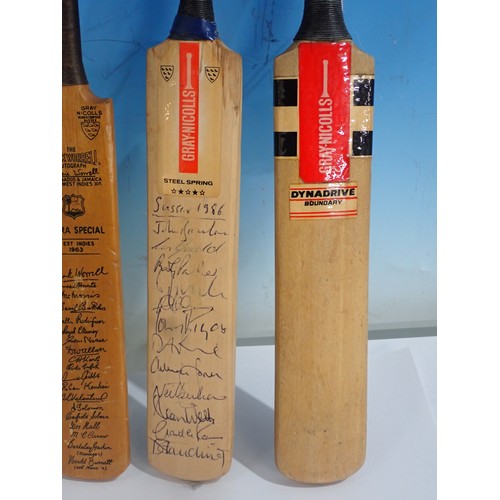 1663 - Five miniature Cricket Bats including Gray-Nicholls signed by Sussex 1986 team and printed New Zeala... 