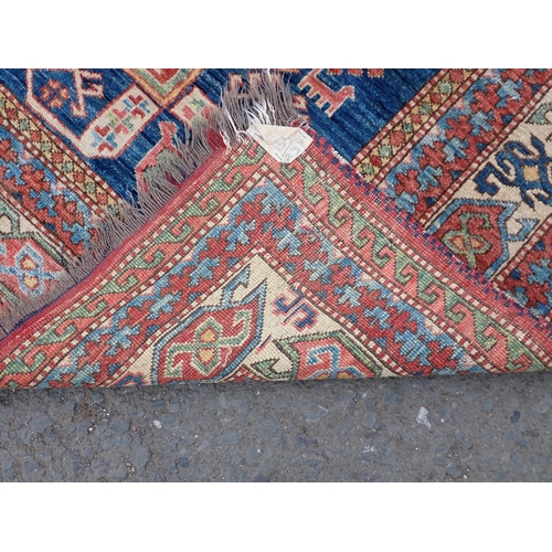 1 - A bordered Persian Rug with multi-bordered design, with stylised motifs on a blue ground, 5ft 2in x ... 