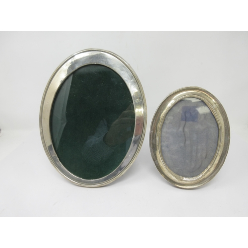 101 - A George V silver plain oval Photograph Frame, Birmingham 1915, 10 x 8in, and another, smaller, Birm... 