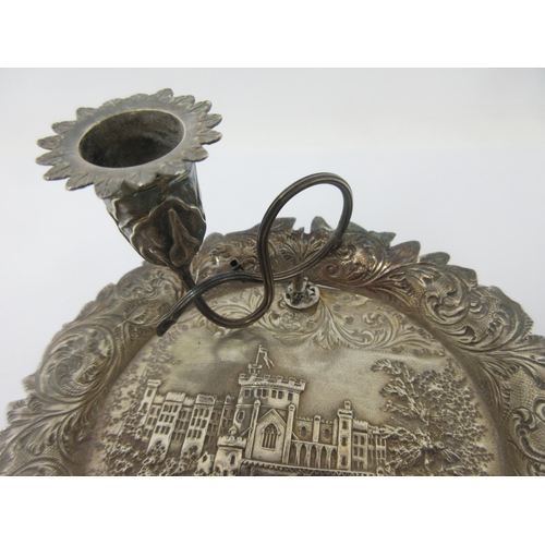 110 - A Victorian silver Chamber Candlestick embossed with castle (possibly Windsor) with leafage scroll s... 