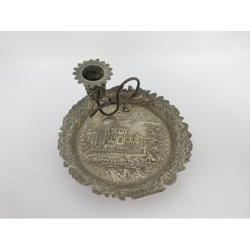 110 - A Victorian silver Chamber Candlestick embossed with castle (possibly Windsor) with leafage scroll s... 