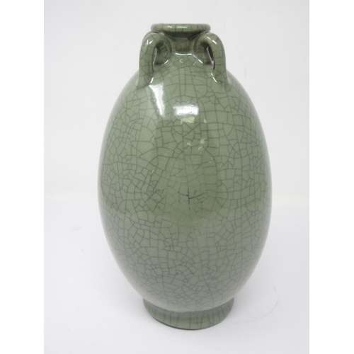 12 - An Oriental celadon ovoid Vase with crackle glaze and four small loop handles, 10in, square seal mar... 