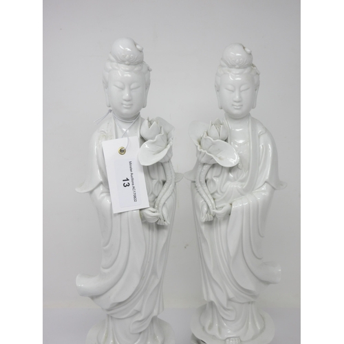 13 - A pair of Chinese blanc de chine Figures holding lilies, 16in