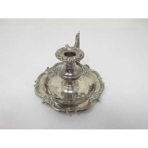 134 - A Victorian silver small Chamber Candlestick with scroll border and Snuffer, Birmingham 1838