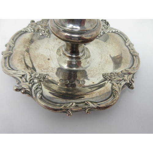 134 - A Victorian silver small Chamber Candlestick with scroll border and Snuffer, Birmingham 1838