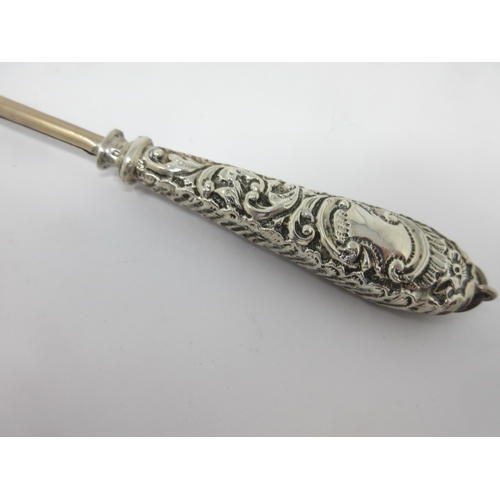 140 - A Victorian silver Telescopic Taper Holder with scroll embossed handle, Chester 1900, 15in