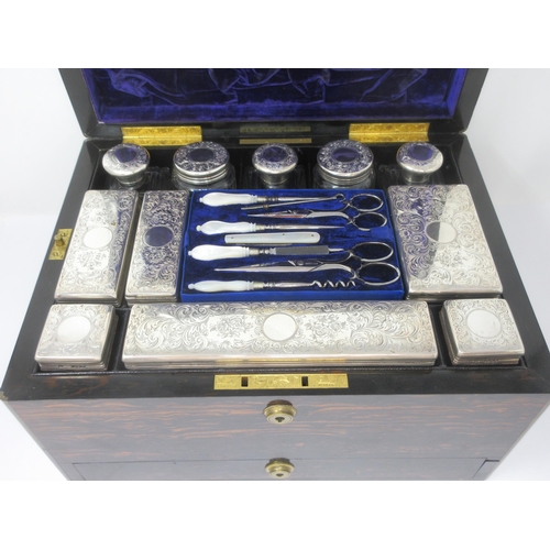 149 - A fine quality Victorian coromandel Travelling Dressing Case, fitted silver mounted accessories with... 