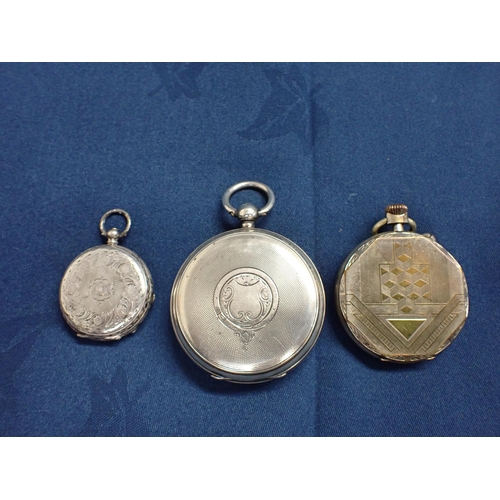 154 - A silver cased Pocket Watch, a silver Fob Watch and a metal 8 day Pocket Watch