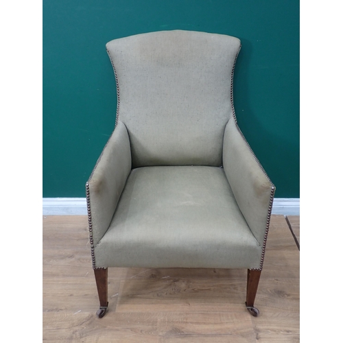 226 - A 19th Century green upholstered Armchair on square cut tapering supports