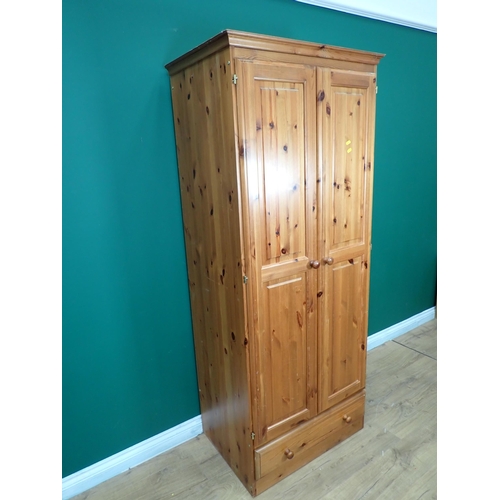 231 - A modern pine two door Wardrobe, Chest of drawers and Bedside Chest