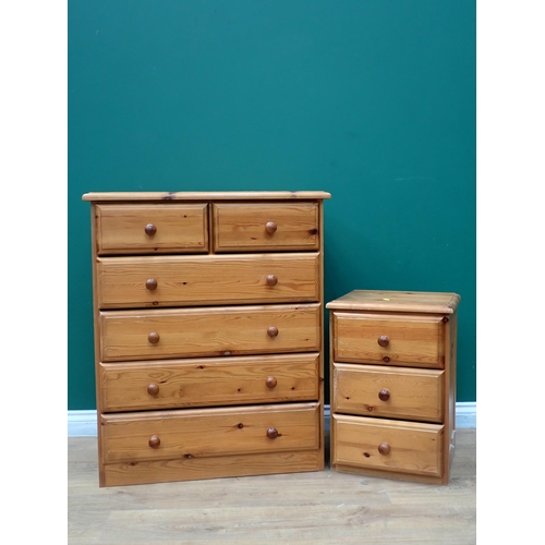 231 - A modern pine two door Wardrobe, Chest of drawers and Bedside Chest