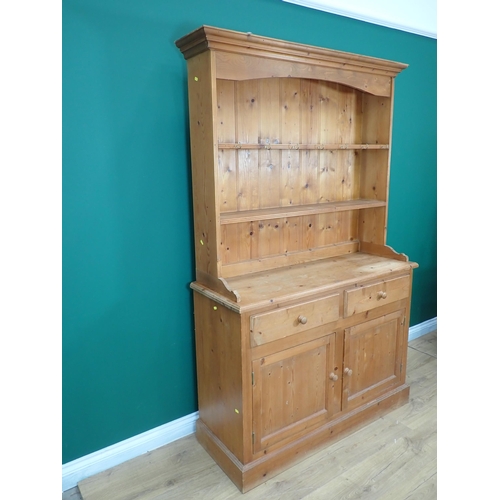 237 - A pine Kitchen Dresser and rack fitted two frieze drawers above pair of cupboard doors 6ft 4in H x 3... 