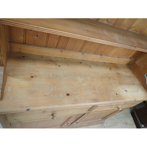 237 - A pine Kitchen Dresser and rack fitted two frieze drawers above pair of cupboard doors 6ft 4in H x 3... 