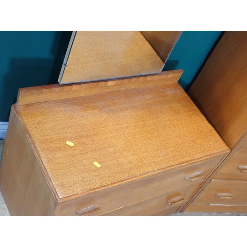 242 - A G-Plan style oak veneered Chest of four drawers and a Dressing Chest