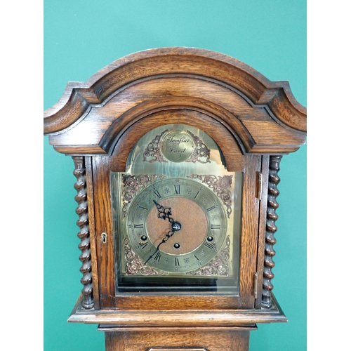 243 - A 20th Century oak cased Grandmother Clock with arched brass dial 5ft 9in H