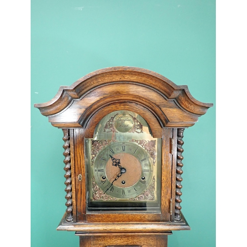 243 - A 20th Century oak cased Grandmother Clock with arched brass dial 5ft 9in H