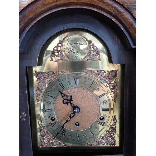 243 - A 20th Century oak cased Grandmother Clock with arched brass dial 5ft 9in H