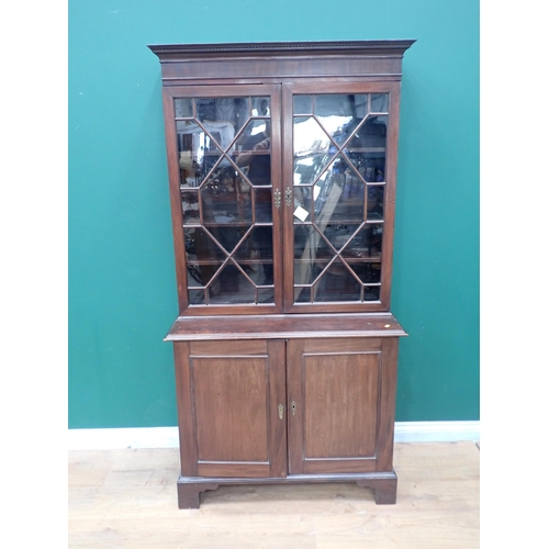 244 - A Georgian mahogany Bookcase fitted pair of astragal glazed doors enclosing adjustable shelves above... 