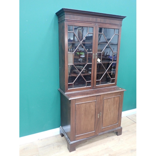 244 - A Georgian mahogany Bookcase fitted pair of astragal glazed doors enclosing adjustable shelves above... 