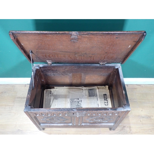 255 - A 17th Century oak Coffer with moulded lid above nulled frieze and rosette carved two panel front 2f... 