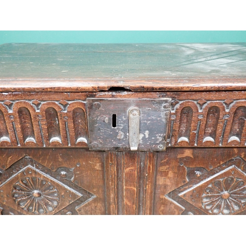 255 - A 17th Century oak Coffer with moulded lid above nulled frieze and rosette carved two panel front 2f... 