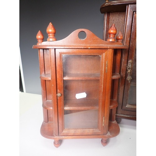 261 - Three small mahogany and glazed Wall Cabinets