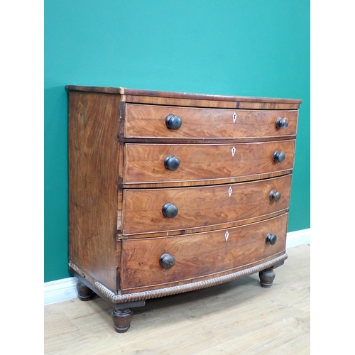 262 - A Regency mahogany bow fronted Chest of four long graduated drawers on turned supports 3ft 4in W x 3... 