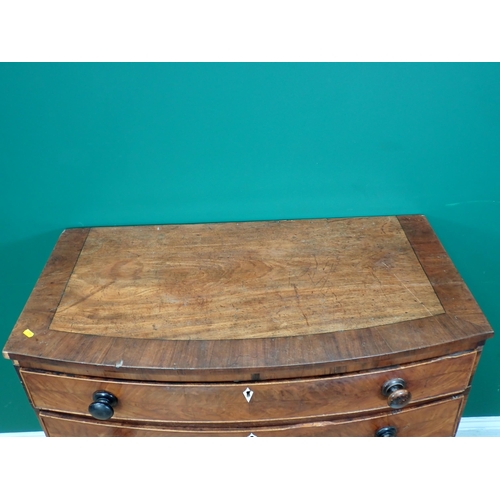 262 - A Regency mahogany bow fronted Chest of four long graduated drawers on turned supports 3ft 4in W x 3... 