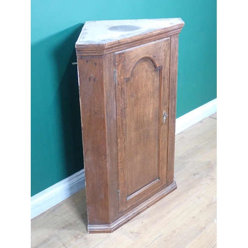 277 - A 19th Century oak hanging Corner Cupboard 2ft 11in H x 2ft 2in W