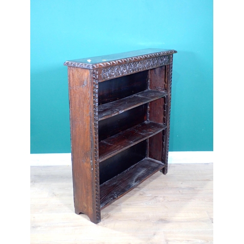 282 - A carved oak open Bookcase with adjustable shelves 3ft 3in H x 2ft 11in W