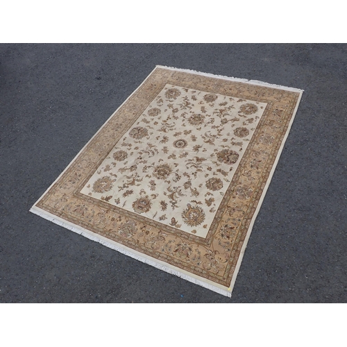 3 - A Persian Carpet with bordered design having stylised floral sprays on a beige ground, 10ft 1in x 7f... 