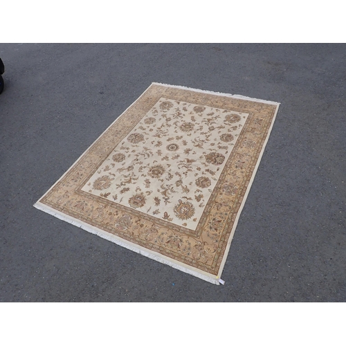 3 - A Persian Carpet with bordered design having stylised floral sprays on a beige ground, 10ft 1in x 7f... 