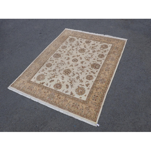 3 - A Persian Carpet with bordered design having stylised floral sprays on a beige ground, 10ft 1in x 7f... 