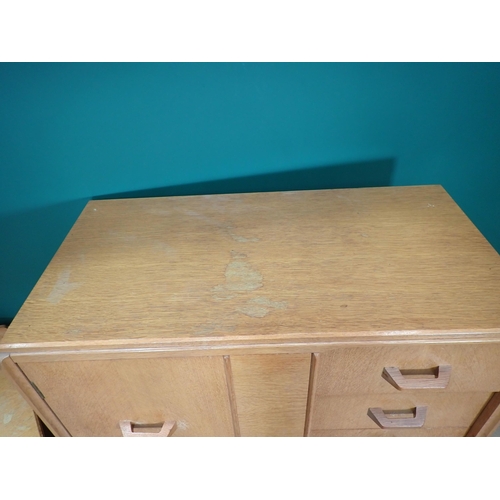 302 - An oak veneered Bedroom Cupboard/Chest and a Dressing Chest