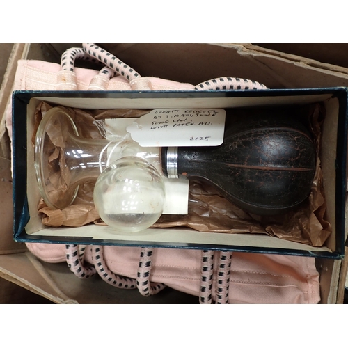 304 - A box of Scientific Instruments including brass syringe, Enema, Truss, etc.