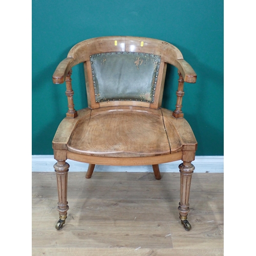 305 - A 19th Century walnut Armchair mounted on reeded tapering front supports with brass casters