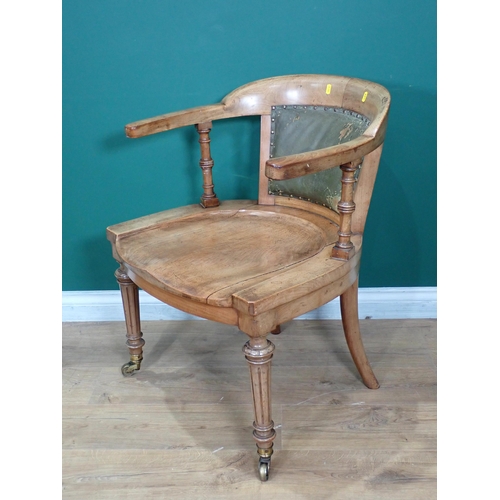 305 - A 19th Century walnut Armchair mounted on reeded tapering front supports with brass casters